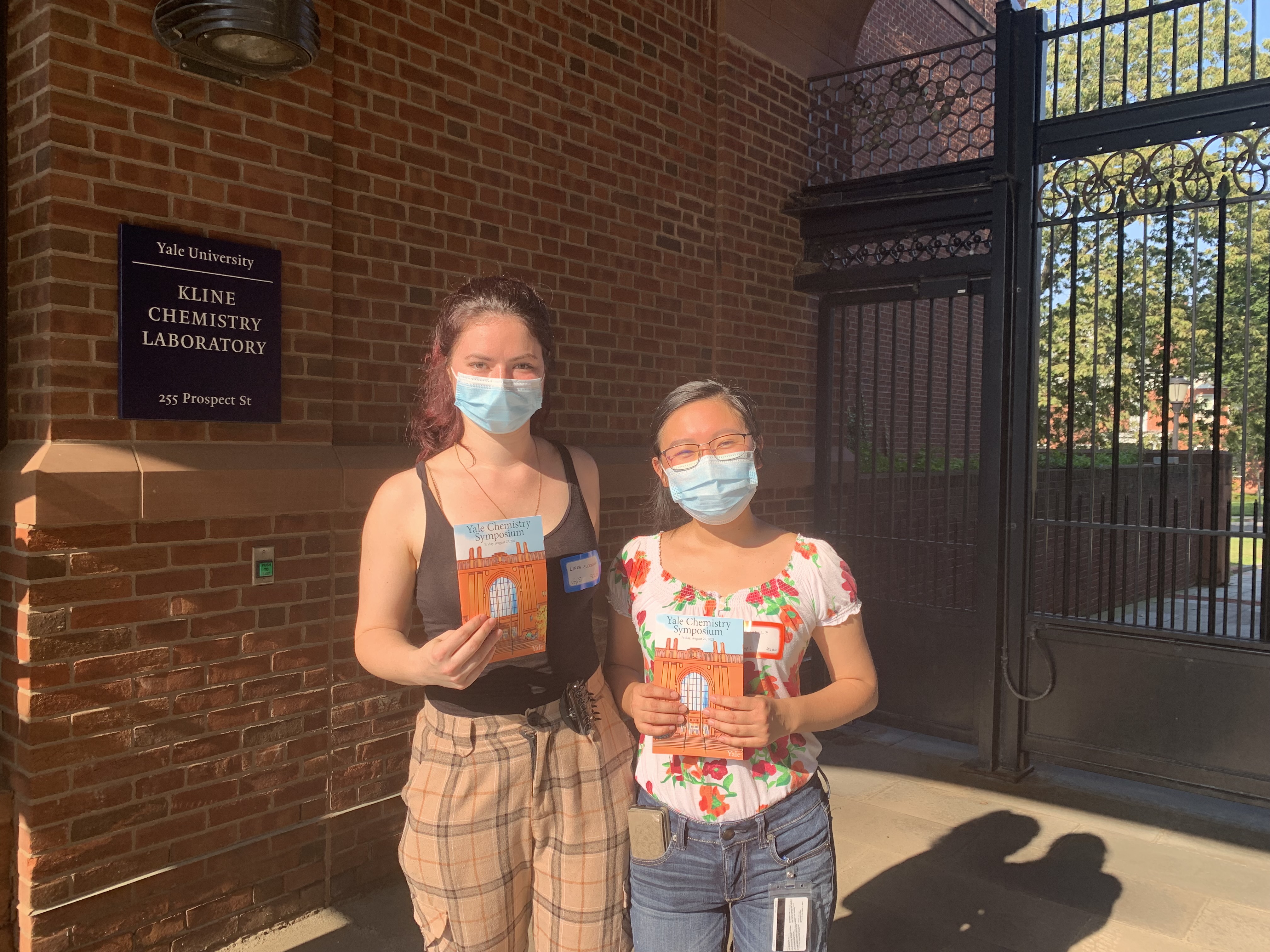 two women holding flyers