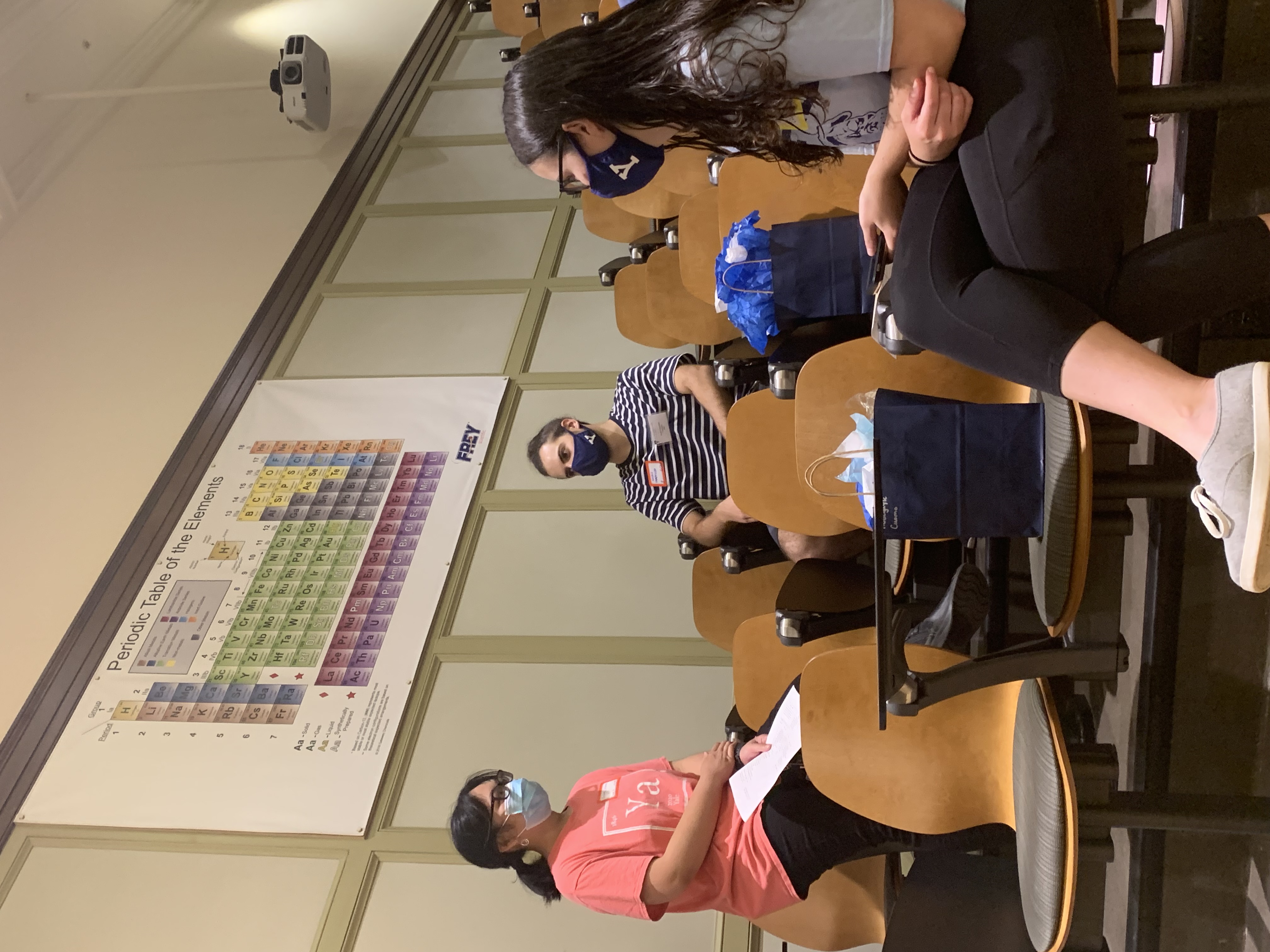 students sitting in chairs chatting