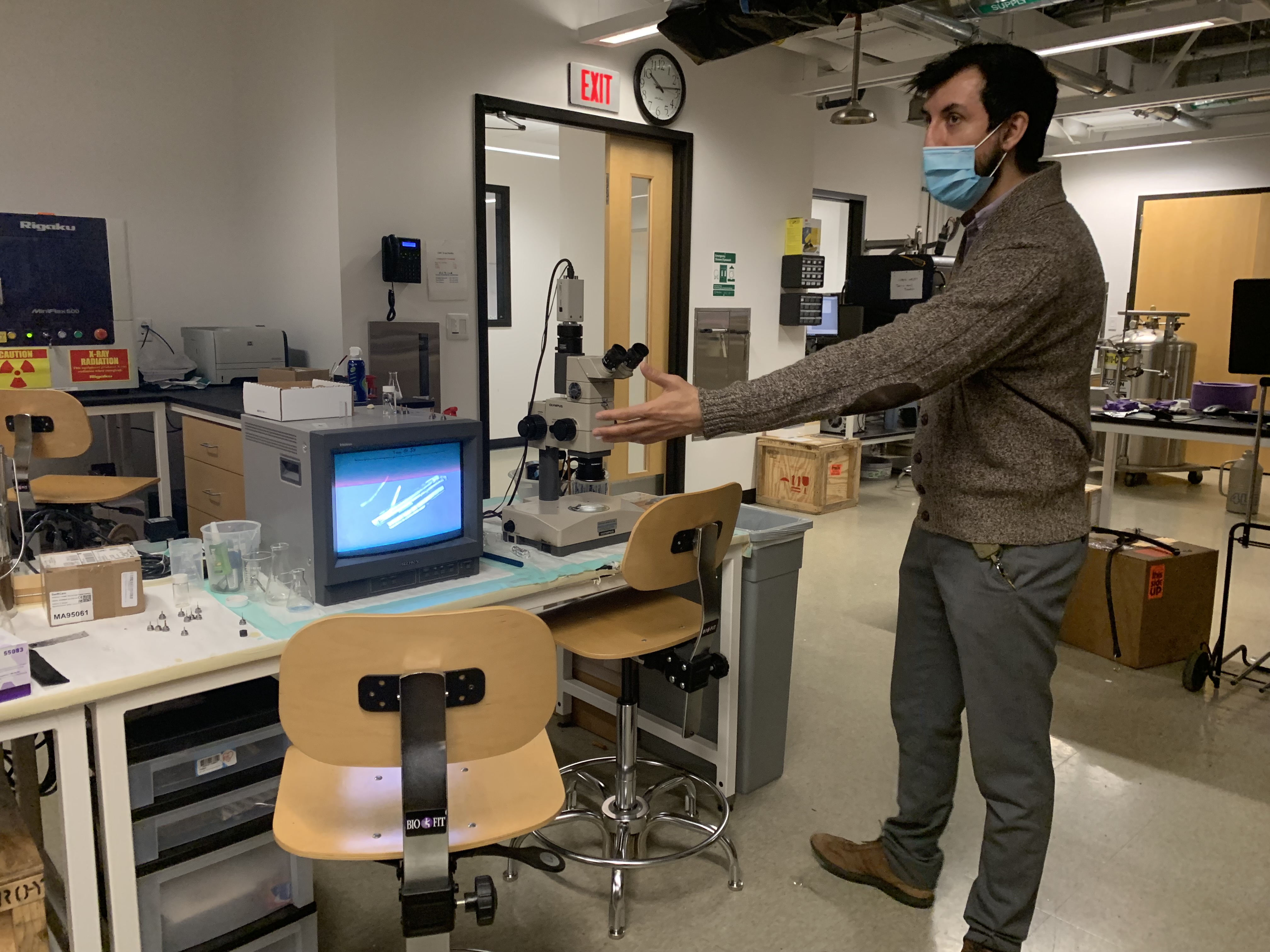 man pointing to computer monitor