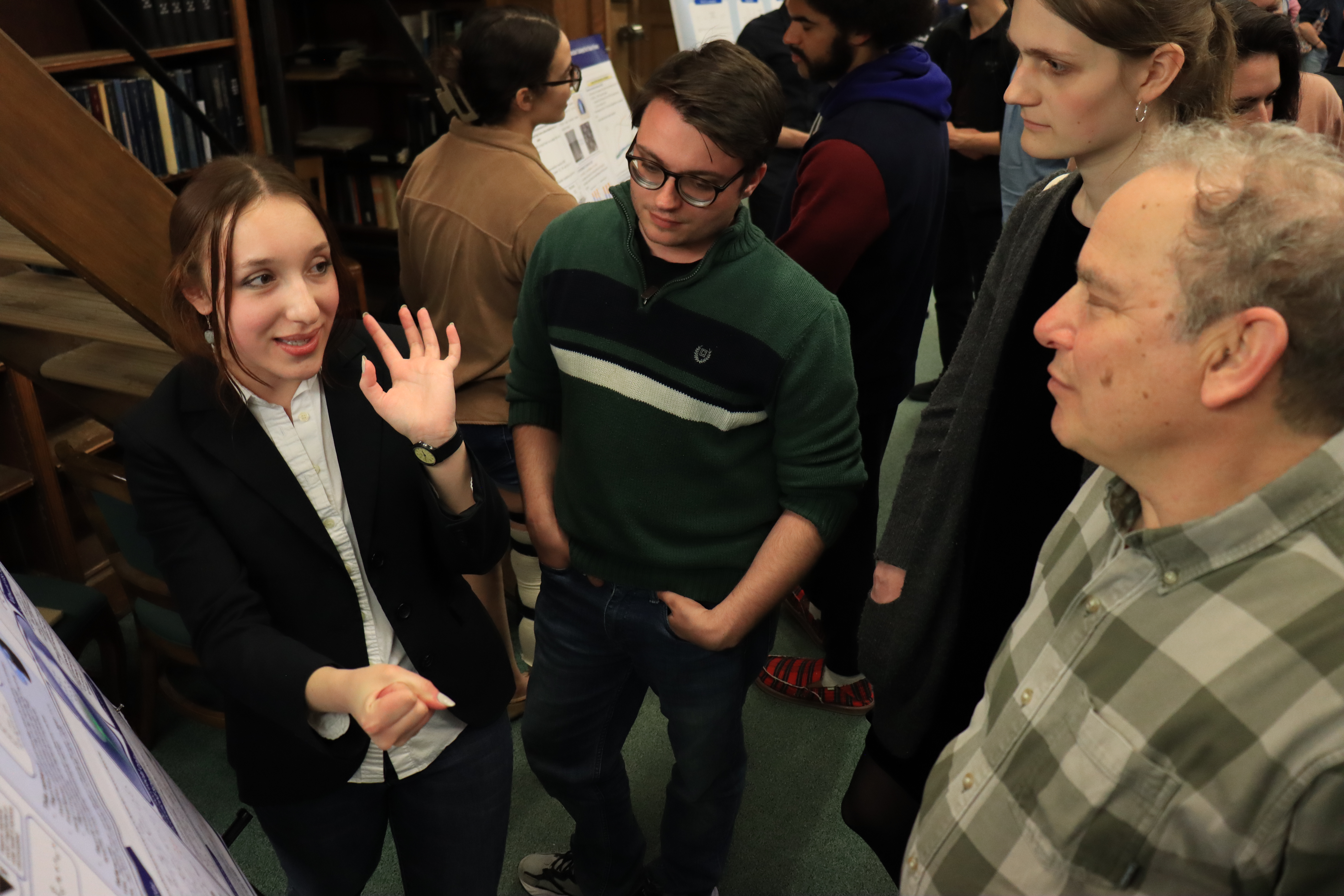 woman gesturing and explaining to people