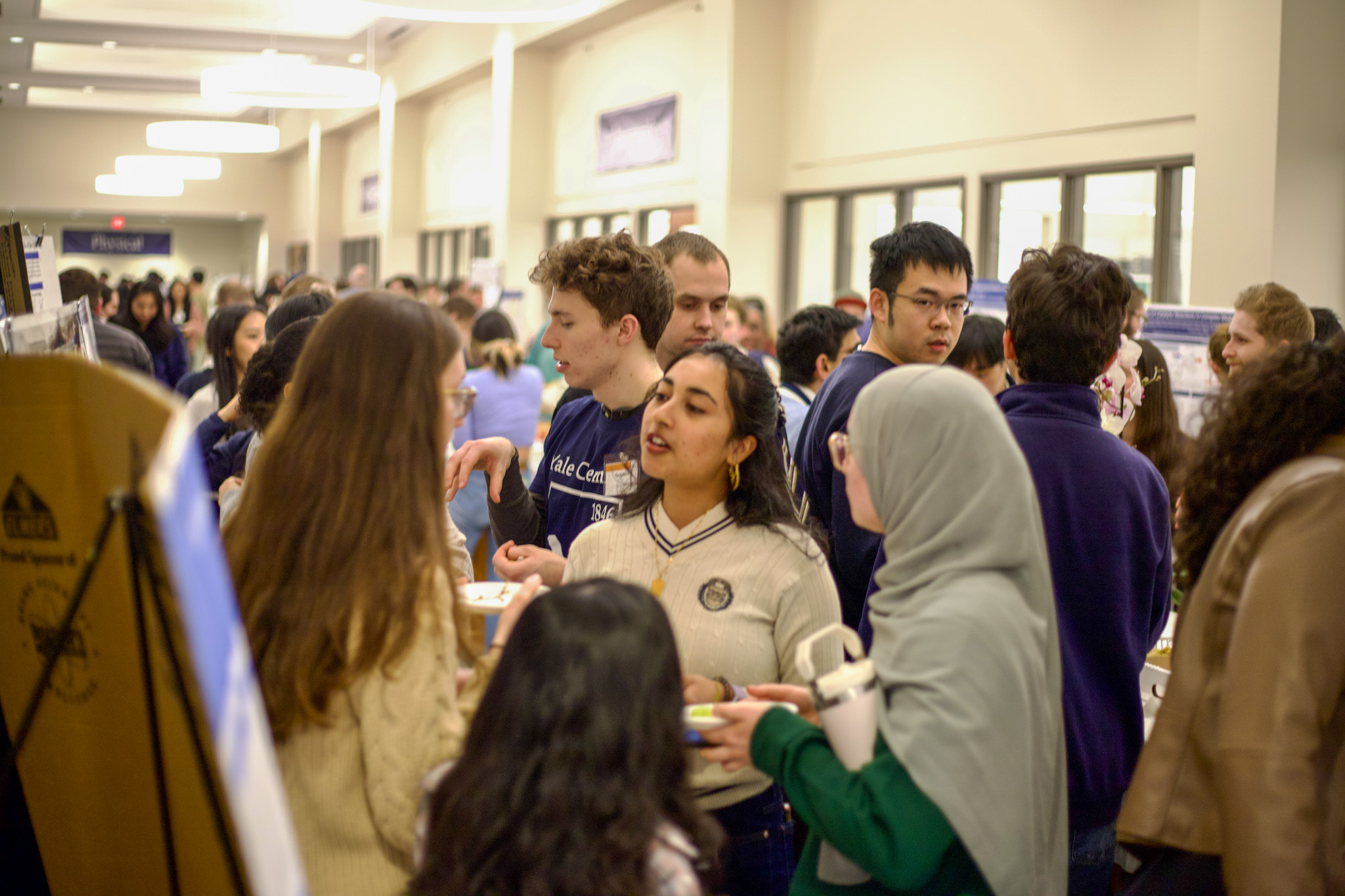 crowd of students in teaching lab hallway