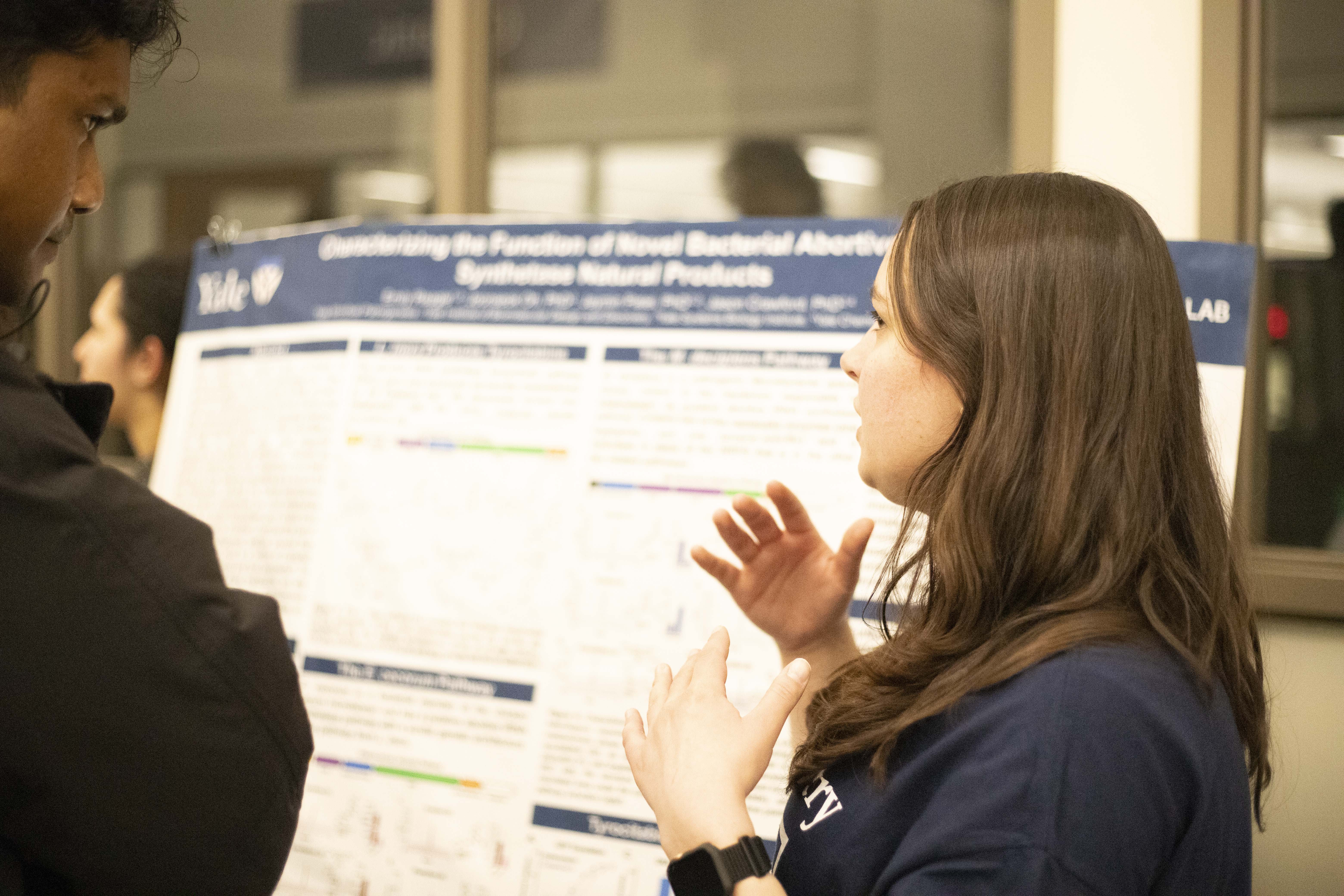 student presenting poster