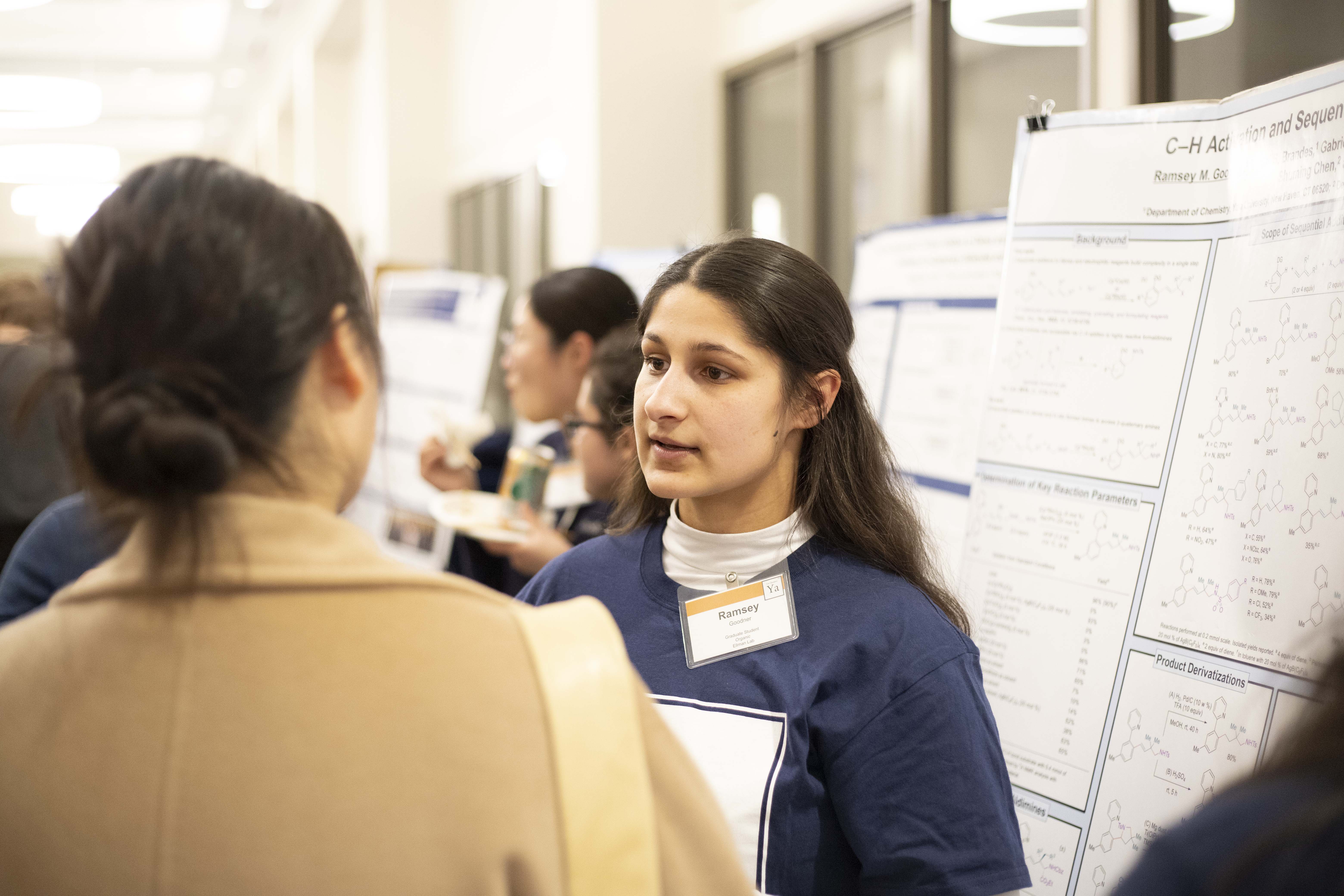 student presenting poster