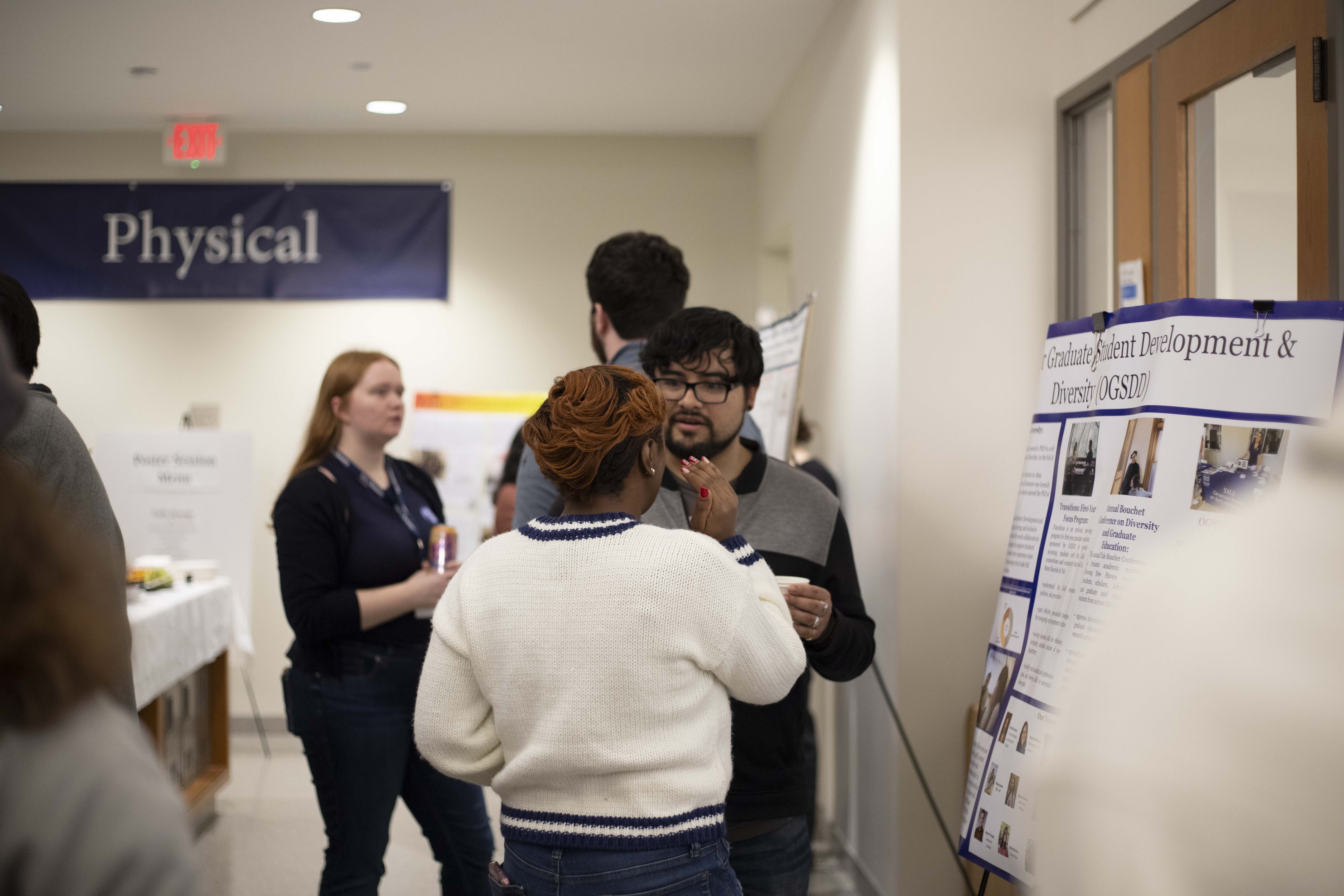 student presenting poster