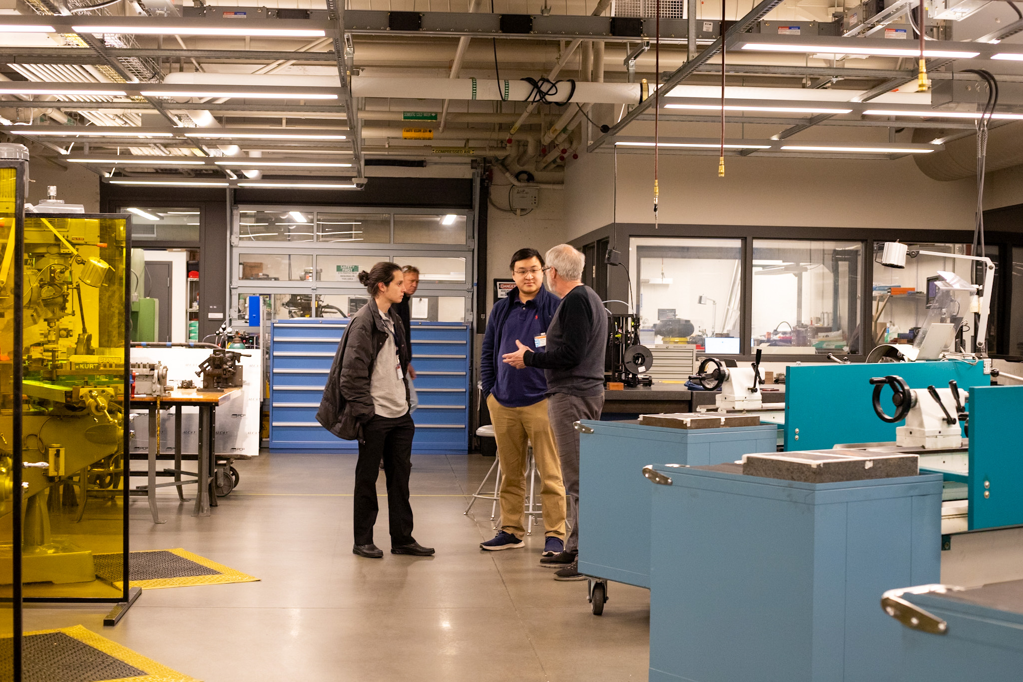 men standing in Chemistry Machine Shop