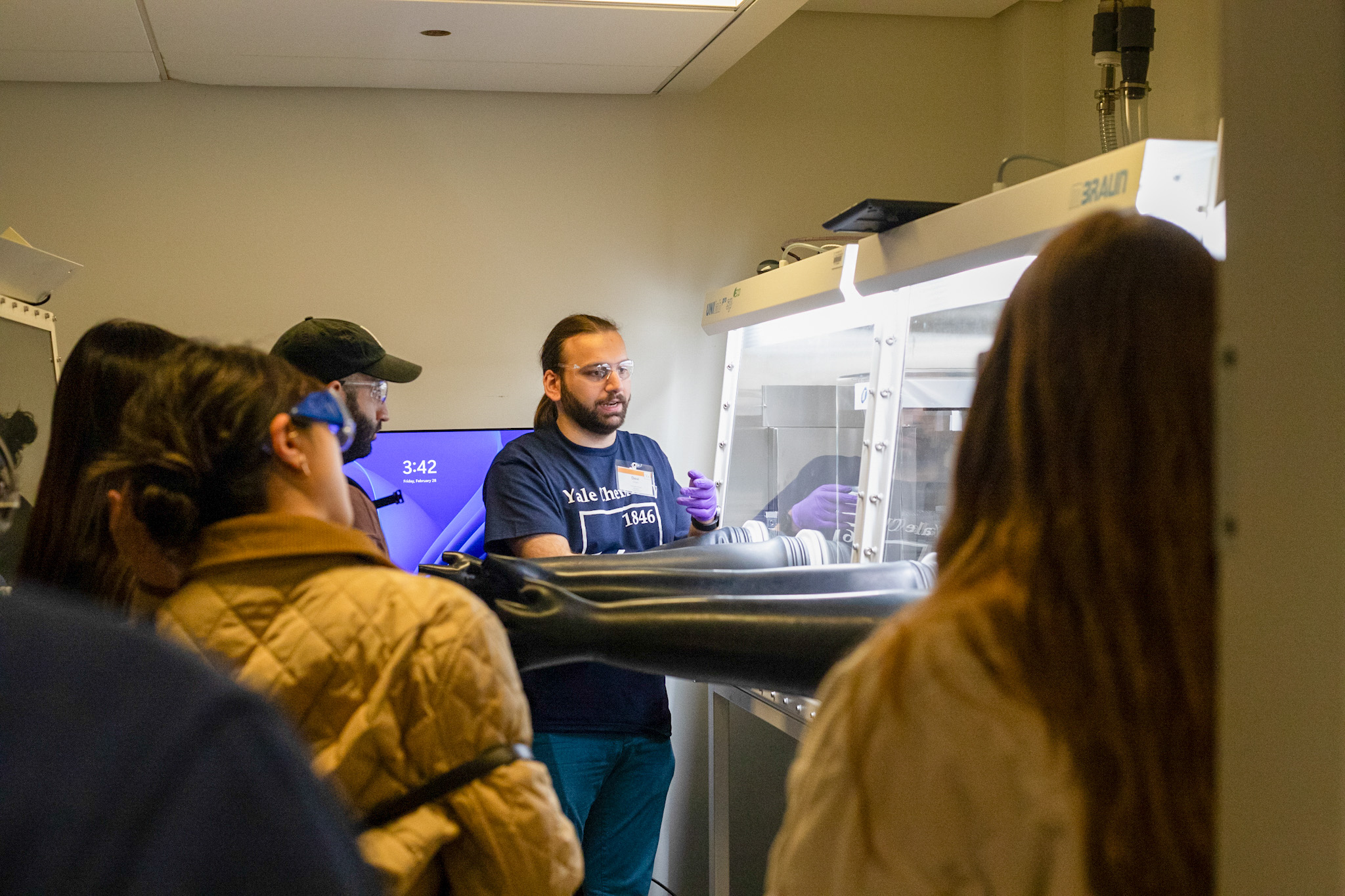 students at chemical glove box