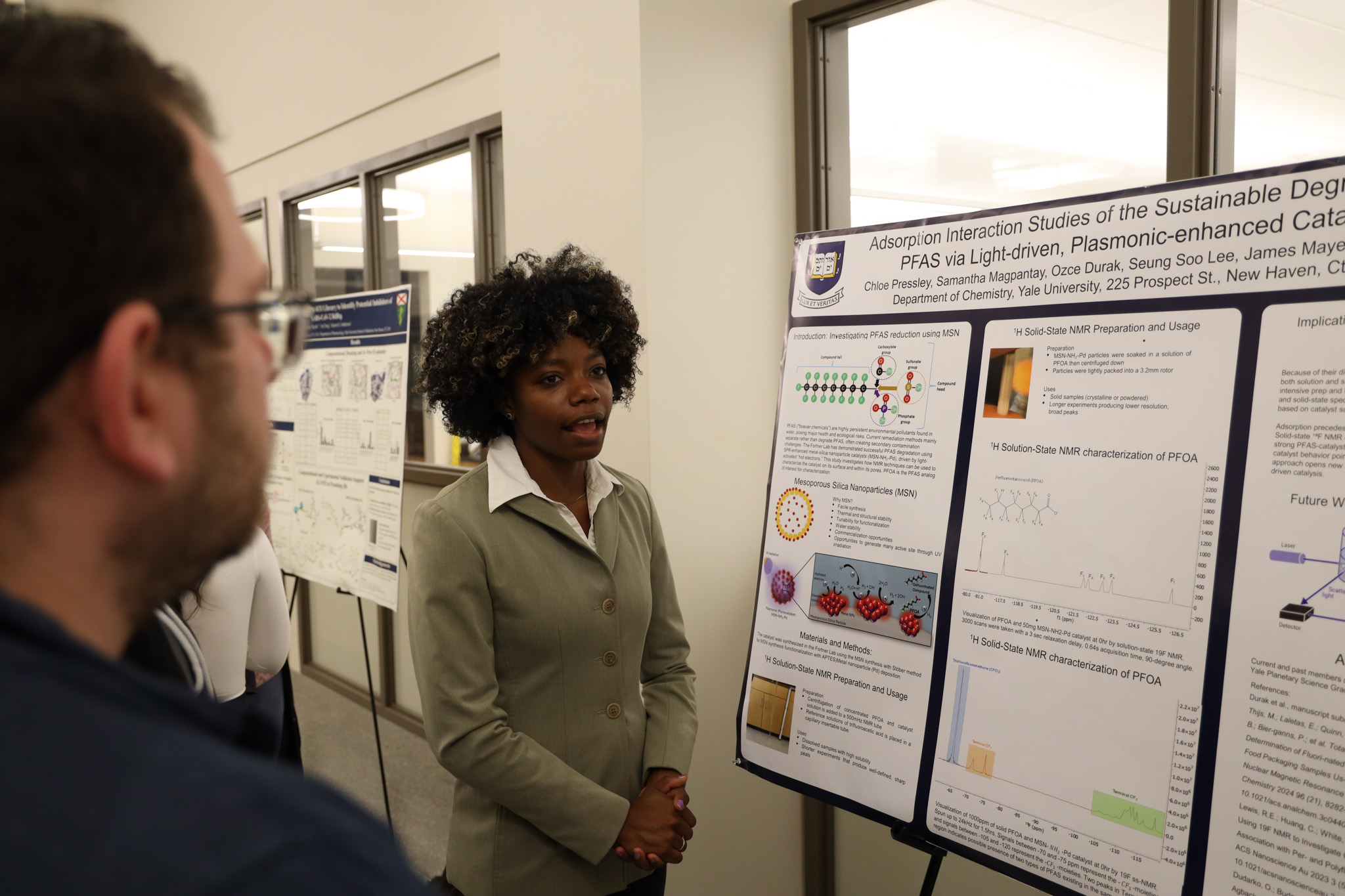 student presenting poster