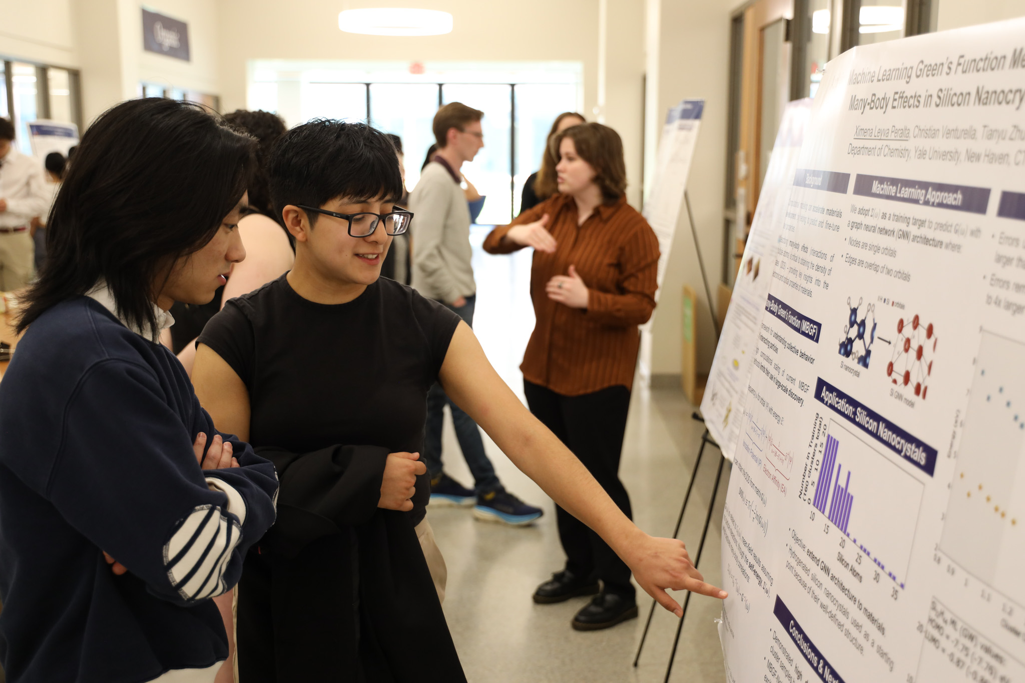 student presenting poster