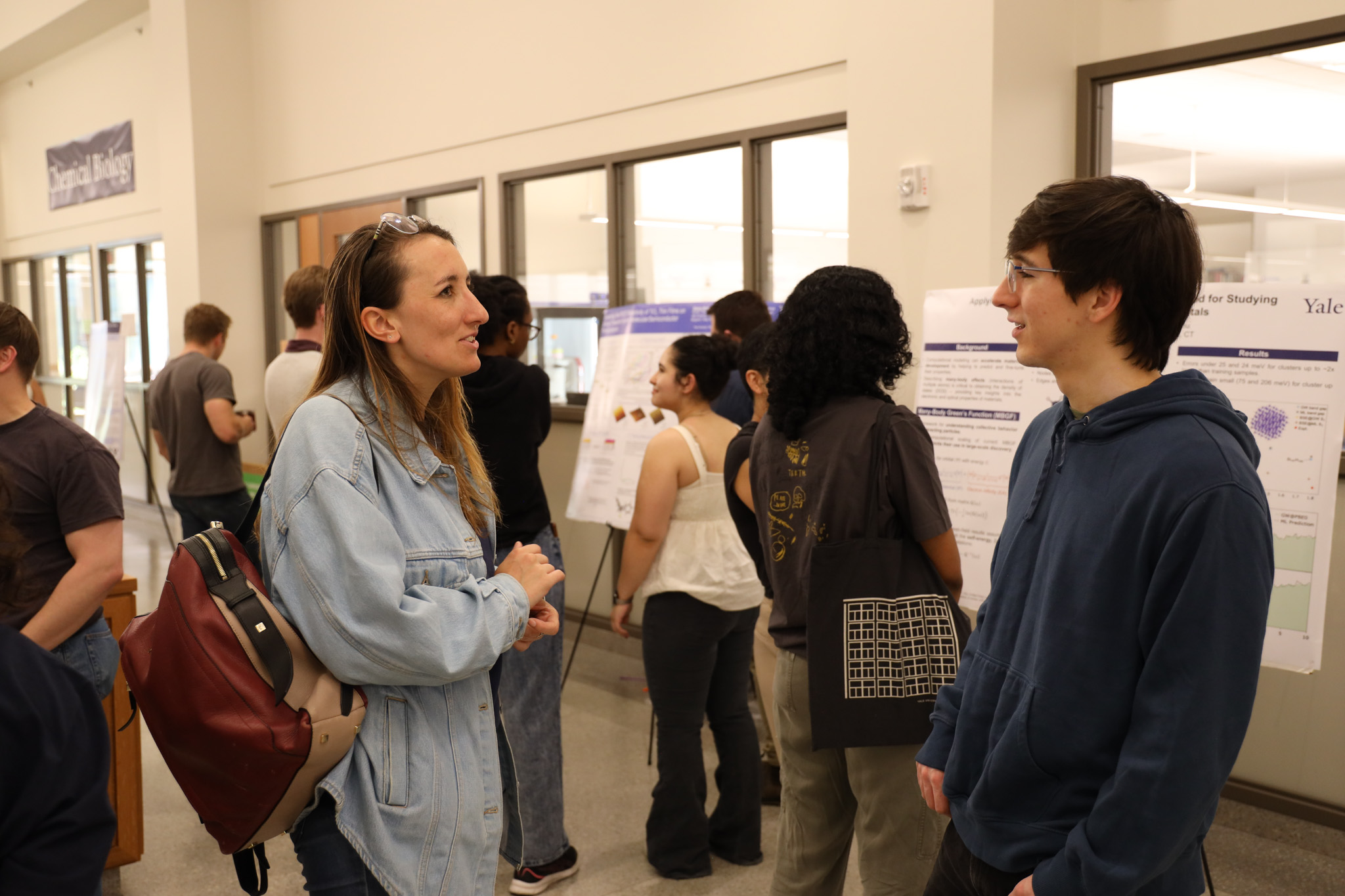 students talking at poster session
