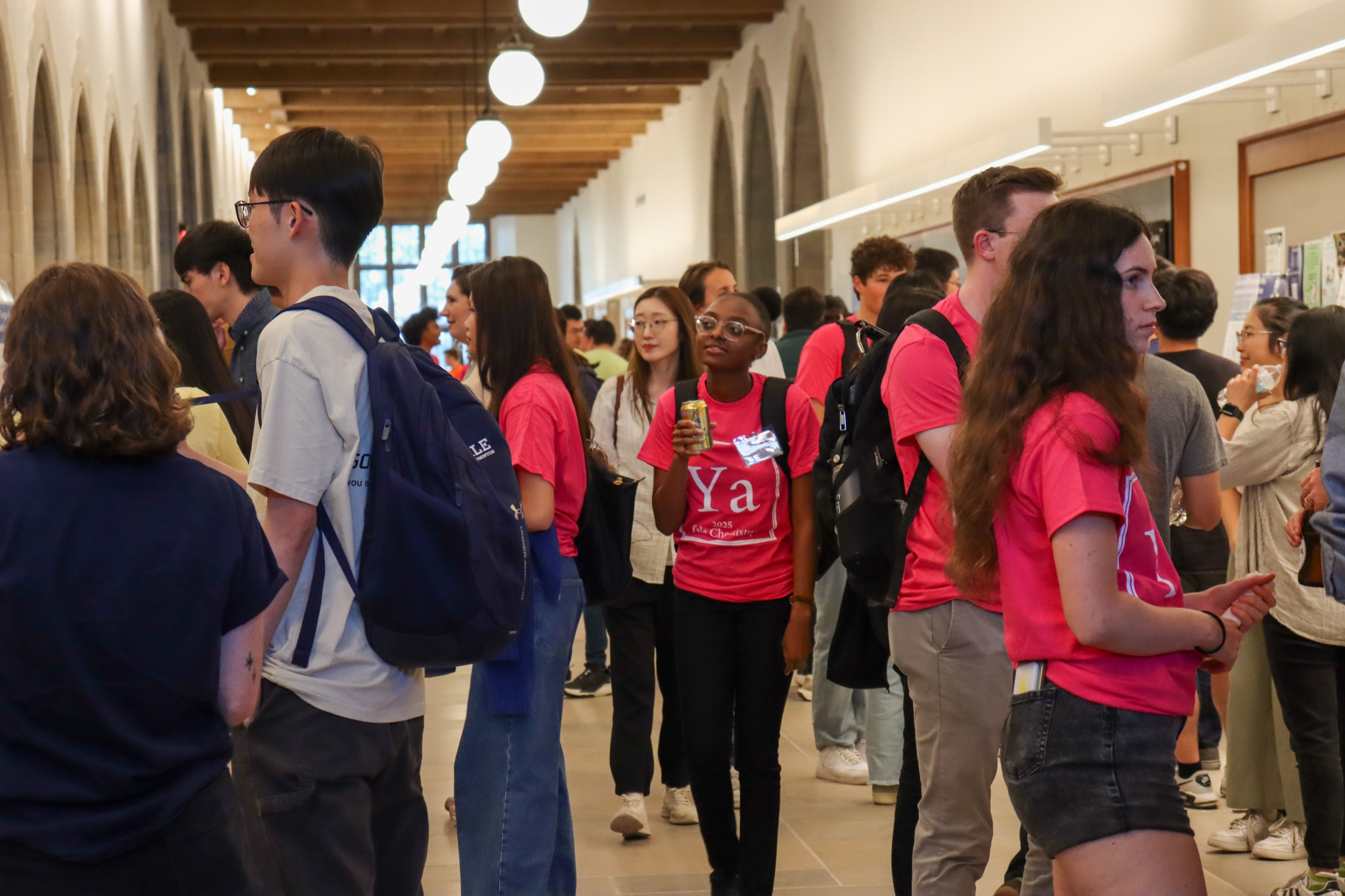 people walking through poster session