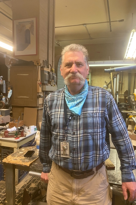 portrait of man in carpenter shop