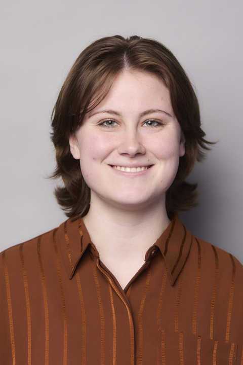 person in brown blouse