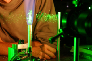 light beam shooting through particles