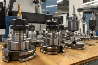 drill bit heads lined up on table