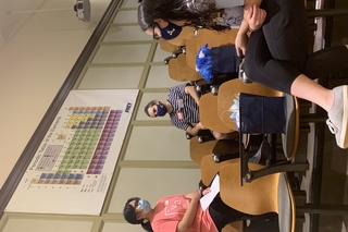 students sitting in chairs chatting