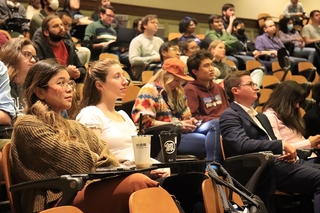 audience of people and chairs