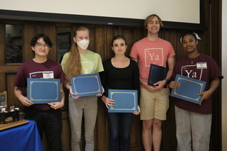 students holding certificates