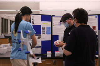 people viewing a poster