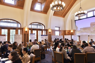 hall full of people at tables