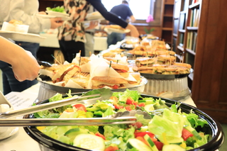 salad bowl and sandwiches on a table