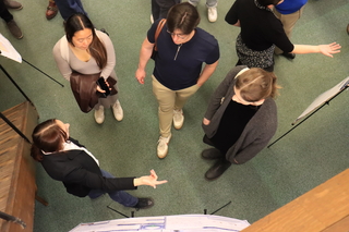 aerial view of people talking near poster