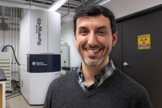 portrait of a man in front of machine