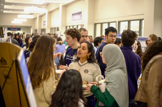 crowd of students in teaching lab hallway