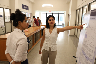 student presenting poster