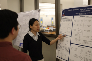 student presenting poster
