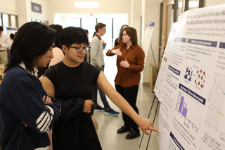 student presenting poster