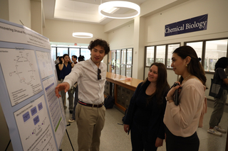 student presenting poster