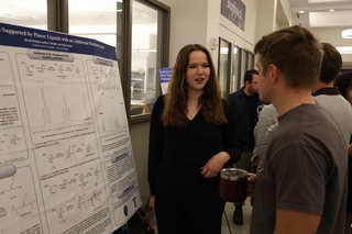 student presenting poster