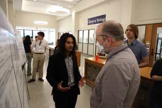 student presenting poster