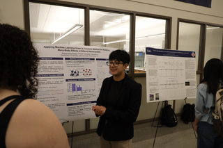 student presenting poster