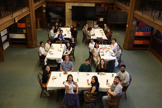 group photo people at lunch tables