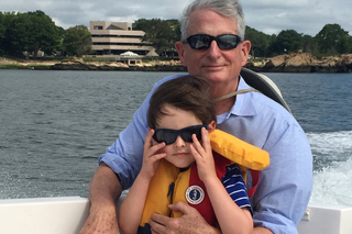 man and child on boat