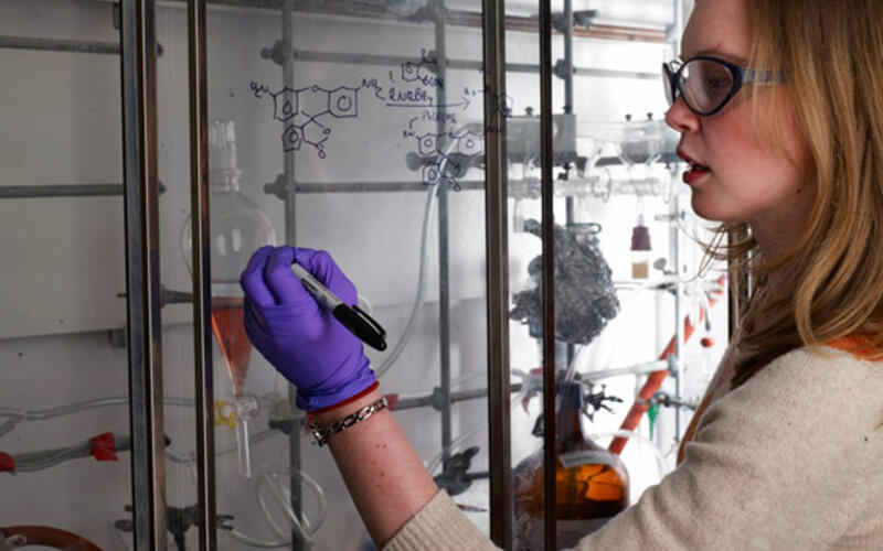 A Yale graduate student makes progress on a research project within an eight foot hood in the Class of '54 Chemical Research Building, a recently completed state-of-the-art research facility.
