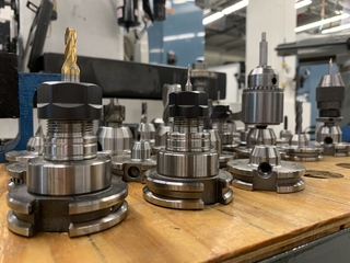 drill bit heads lined up on table