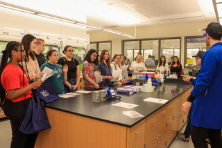students standing at lab bench