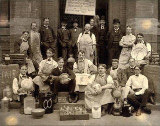 old sepia group photo men on steps