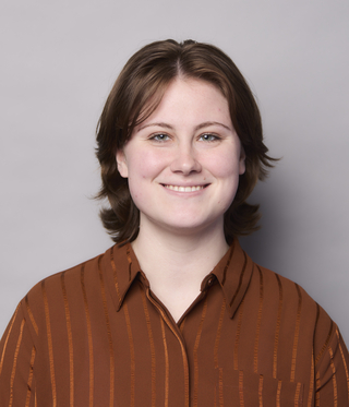 person in brown blouse