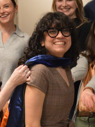 graduate wearing sash