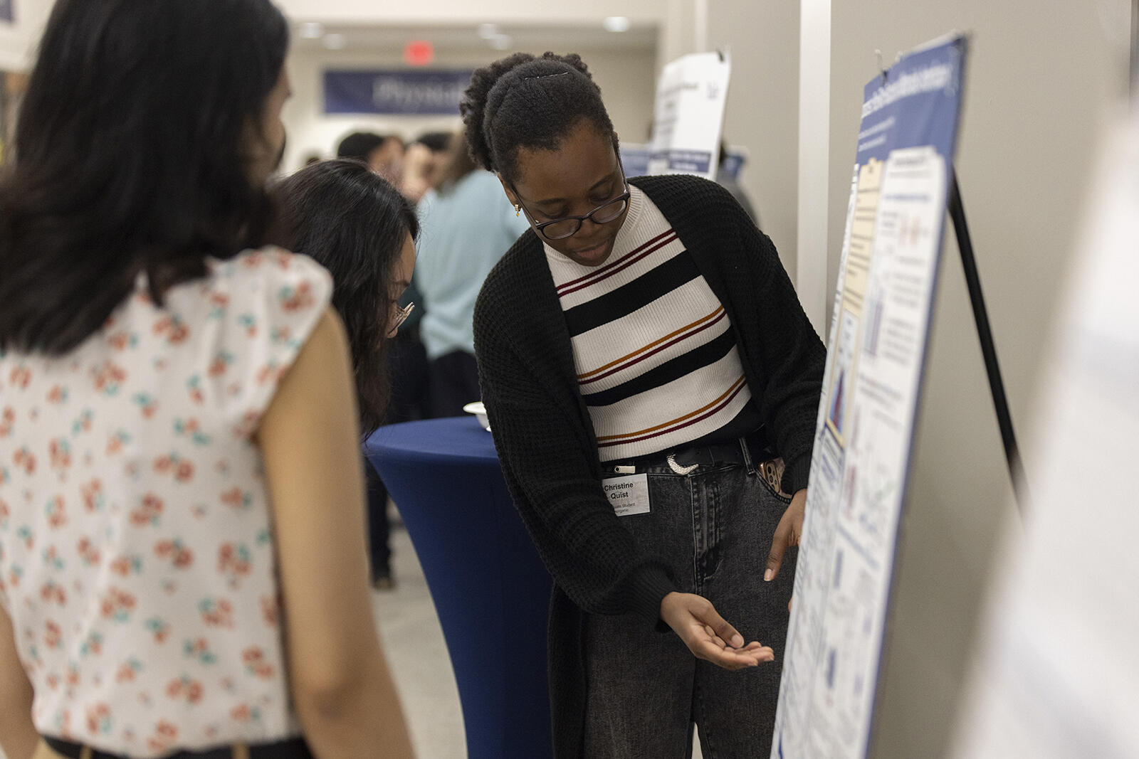 woman pointing to poster data