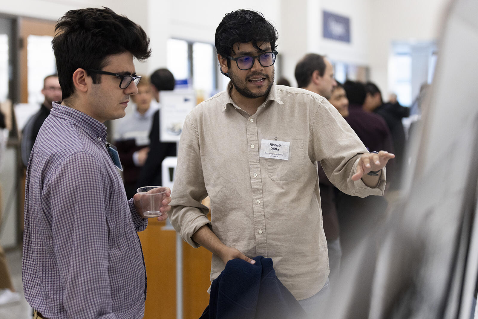 man pointing to poster data