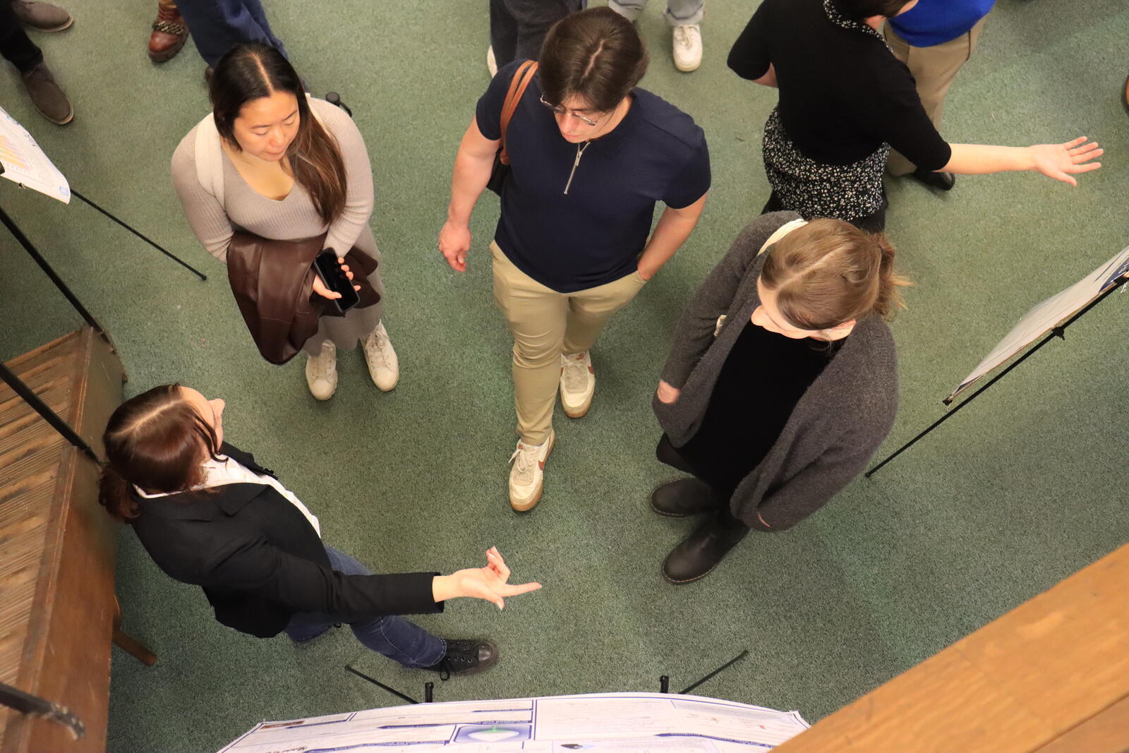 aerial view of people talking near poster