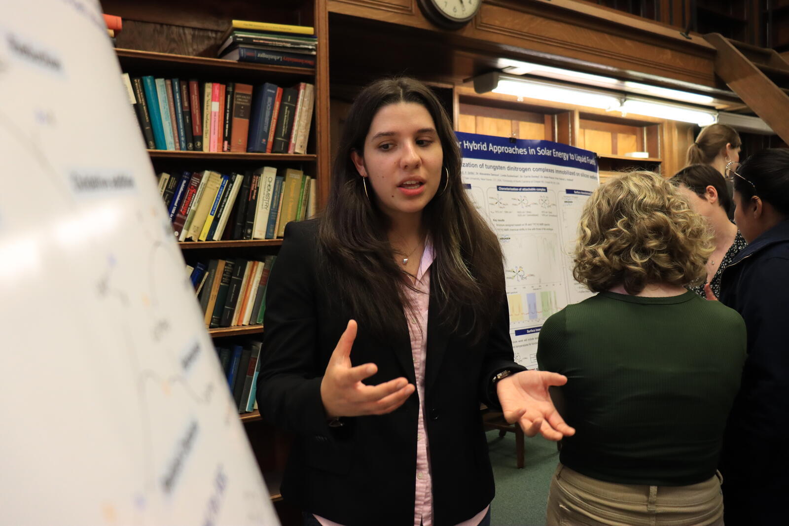 woman pointing at poster