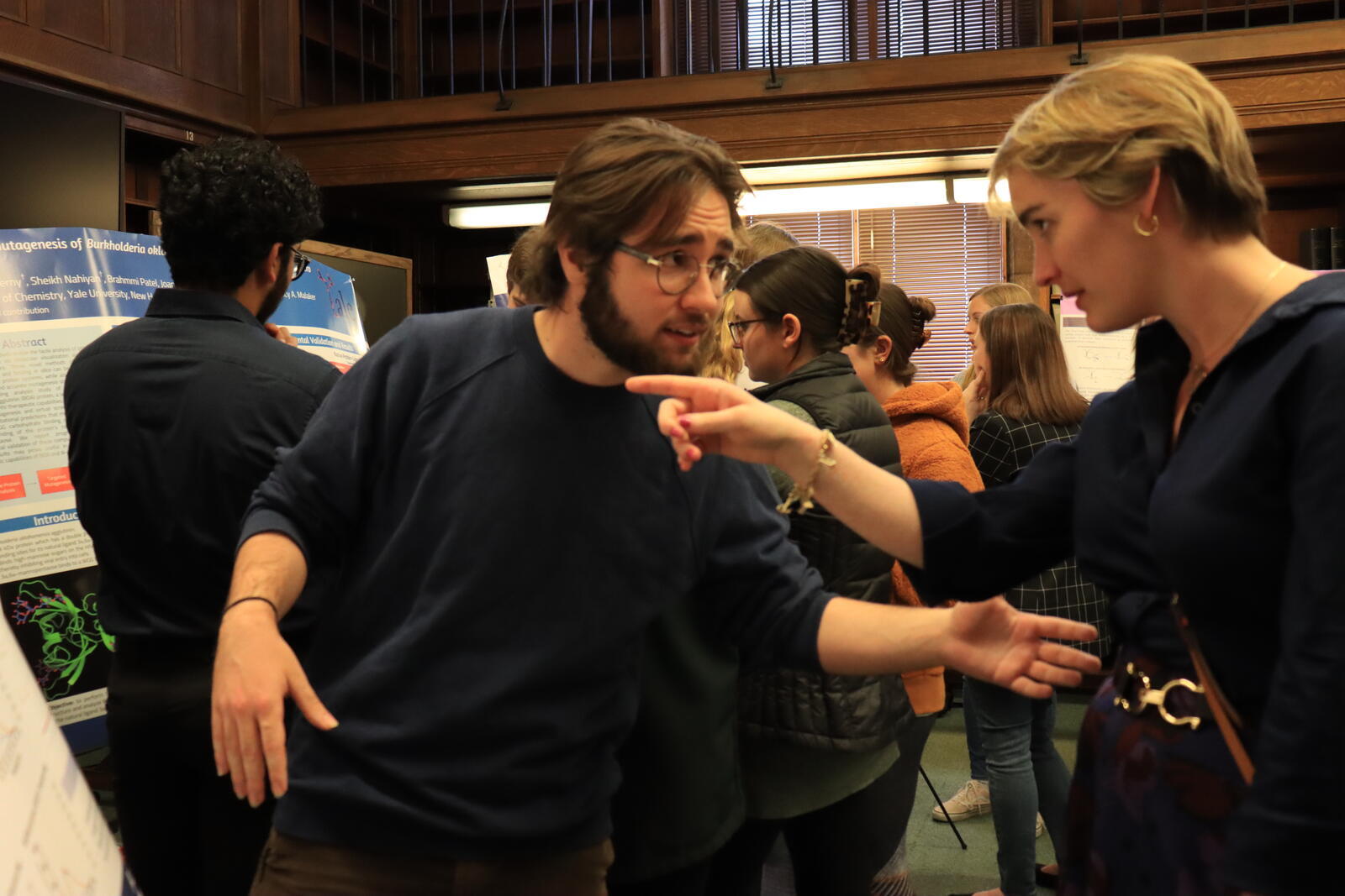 people talking woman pointing 